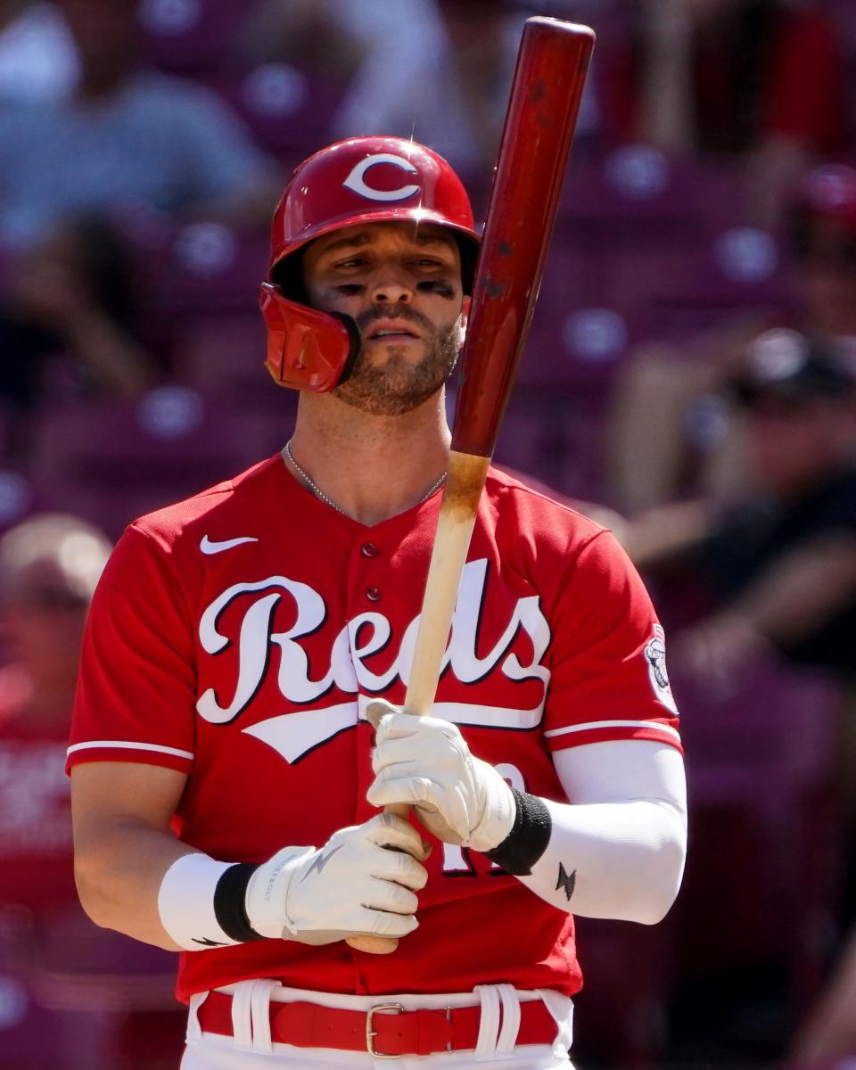 Cincinnati Reds right fielder Tyler Naquin (12) steps into the batterÕs box during the eighth inning of a baseball game against the Tampa Bay Rays, Sunday, July 10, 2022, at Great American Ball Park in Cincinnati. The Cincinnati Reds won, 10-5.