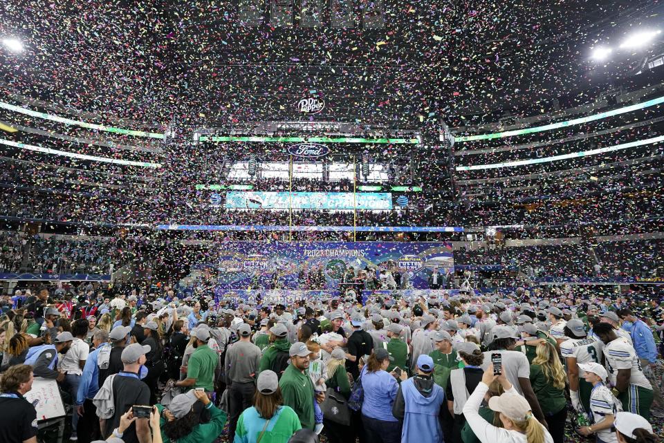Confetti is blown in the air after the Cotton Bowl NCAA college football game between Southern California and Tulane, Monday, Jan. 2, 2023, in Arlington, Texas. (AP Photo/Sam Hodde)
