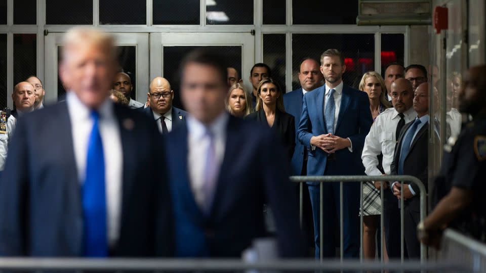 Eric Trump listens as former President Donald Trump speaks to the media after being found guilty on all 34 counts in his hush money trial at Manhattan Criminal Court on May 30, 2024. - Justin Lane/Pool/Getty Images