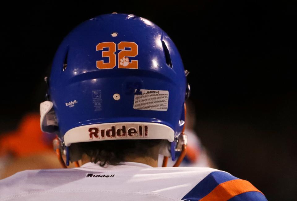 Players from Delmar wear the 32 of Carter Figgs, who lost his life in a car accident last week, in Delmar's 30-27 win at Lake Forest High School, Thursday, Oct. 12, 2023.