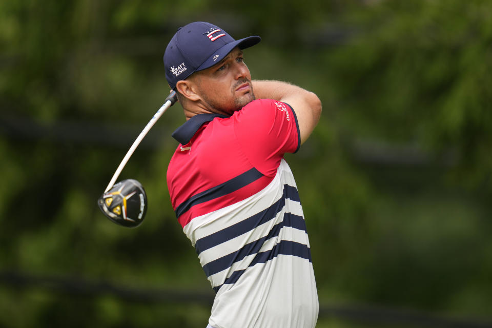 Bryson DeChambeau watches his shot on the 17th hole during the first round of the U.S. Open golf tournament at The Country Club, Thursday, June 16, 2022, in Brookline, Mass. (AP Photo/Julio Cortez)