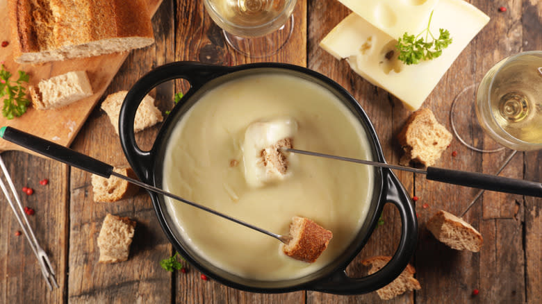 cheese fondue with bread and wine