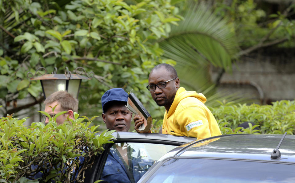 Evan Mawarire, an activist and pastor who helped mobilize people to protest against the hike in fuel prices, is arrested at his residence in Harare, Zimbabwe, Wednesday, Jan. 16, 2019. Mawarire was arrested Wednesday for allegedly inciting violence in the protests against the government's increase in fuel prices. (AP Photo/Tsvangirayi Mukwazhi)