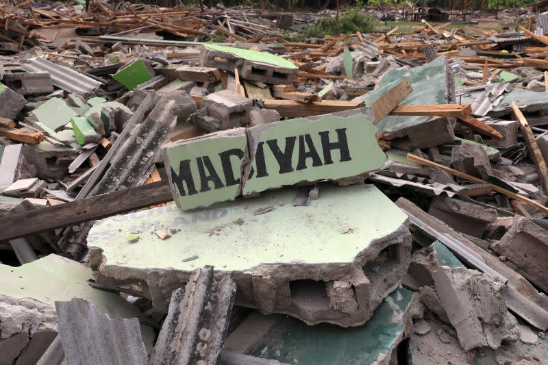 Broken blocks of a building are seen at the site of demolition of the Okun glass community in Lagos