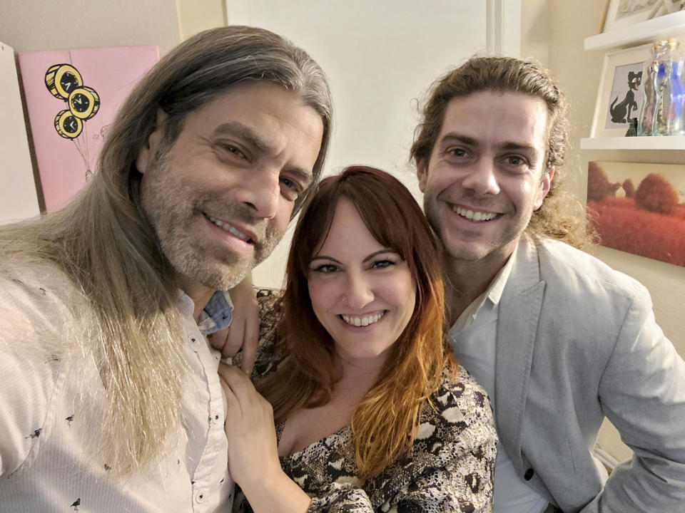 This image provided by Ryan Cohen shows, from left, Ryan Cohen, his wife, Emily Taffel, and Taffel's former boyfriend, Sam Rubman, on Feb. 3, 2022, in Coral Springs, Fla. In the era of intense cybersecurity and calls for multifactor lockdown of all things digital, the three share several logins to streaming services. (Ryan Cohen via AP).