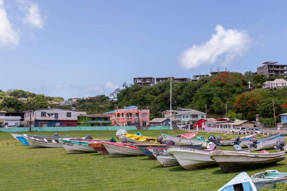 Fishing boats lie in a field after being moved ahead of Hurricane Beryl in Calliaqua, St. Vincent (AP)