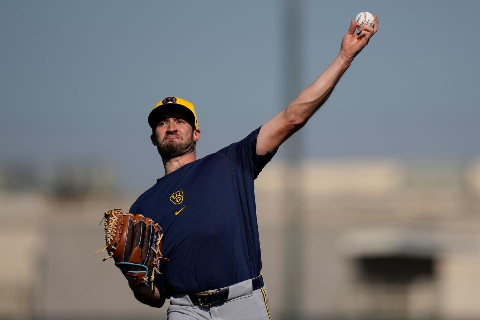 Milwaukee Brewers pitcher Aaron Ashby throws during spring training baseball workouts in Phoenix, Sunday, Feb. 18, 2024. (AP Photo/Carolyn Kaster)