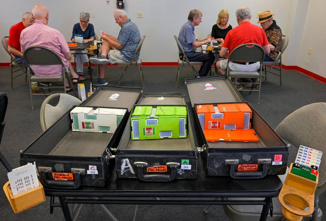 Fresh decks of cards were ready to go for a group of about 80 people gathered to play bridge on a Friday earlier this month at the Bridge Studio in Overland Park.