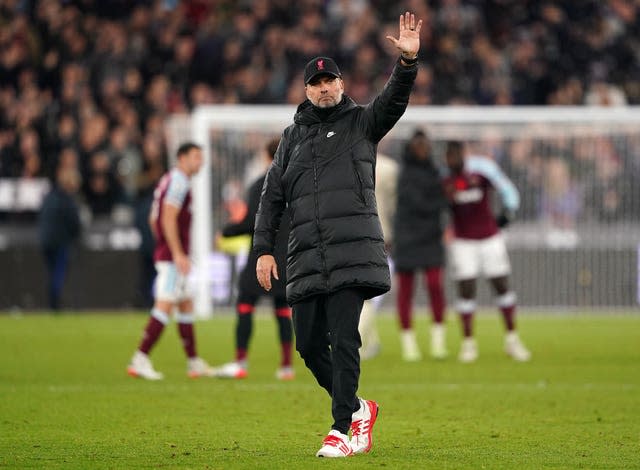 Jurgen Klopp waves to the Liverpool fans