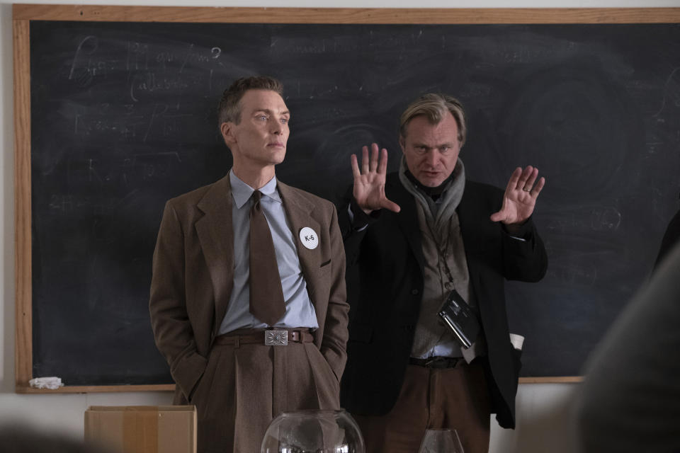 This image released by Universal Pictures shows writer-director-producer Christopher Nolan, right, and actor Cillian Murphy on the set of "Oppenheimer." (Melinda Sue Gordon/Universal Pictures via AP)