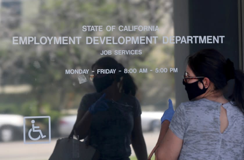 CANOGA PARK, CA - MAY 14: Maria Mora came to find information about her claim but found the California State Employment Development Department was closed due to coronavirus concerns on Thursday, May 14, 2020 in Canoga Park, CA. (Brian van der Brug / Los Angeles Times)