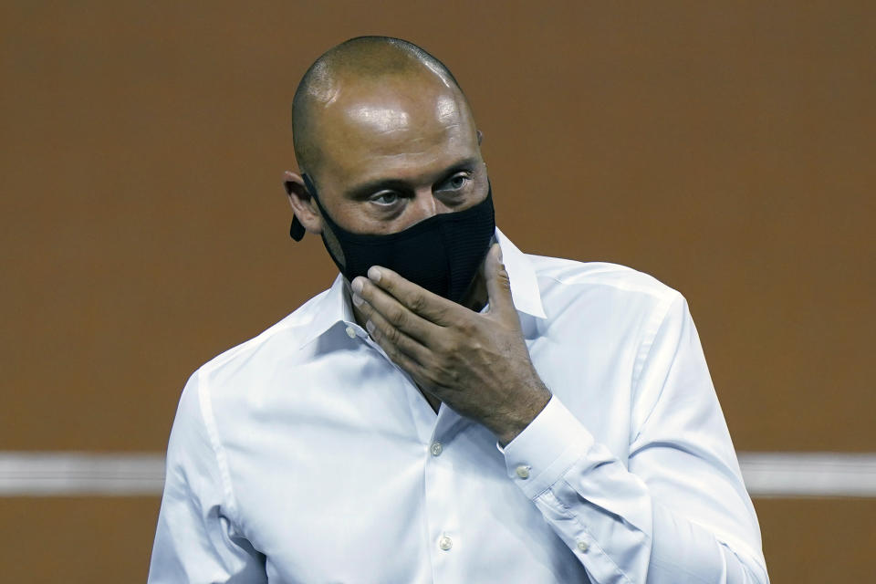 FILE - Miami Marlins CEO Derek Jeter is shown before the start of a baseball game between the Marlins and the Philadelphia Phillies in Miami, in this Saturday, Sept. 12, 2020, file photo. The attendance-challenged Marlins plan to have fans at home games, although crowds will initially be limited to about 25% of capacity. That would mean up to around 9,300 spectators at the 37,446-seat ballpark. “We look forward to having the opportunity to have fans come back to our ballpark,” CEO Derek Jeter said Monday, Feb. 15, 2021. (AP Photo/Wilfredo Lee, File)