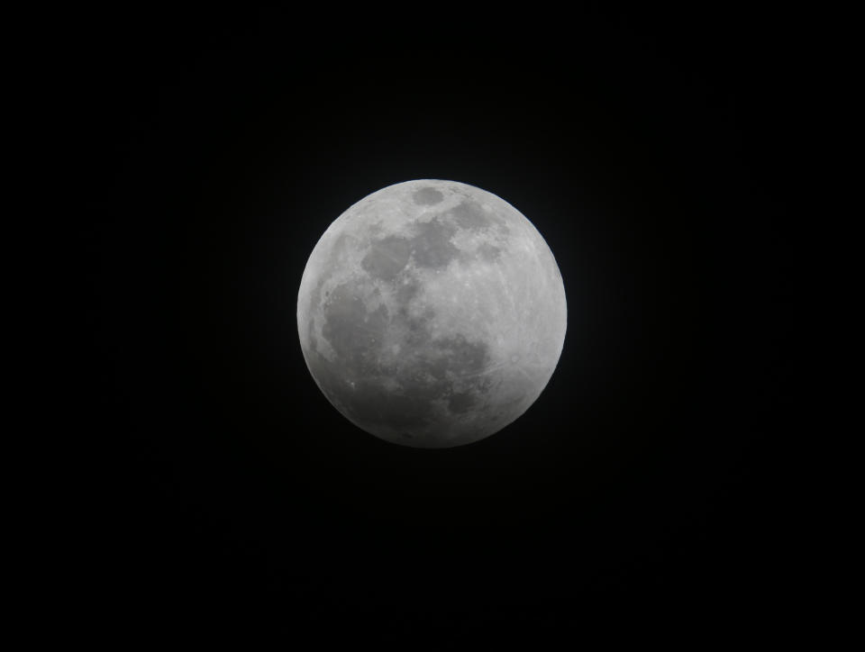 A supermoon is seen in Los Angeles, Sunday, Jan. 20, 2019. The year's first supermoon, when a full moon appears a little bigger and brighter thanks to its slightly closer position to Earth, is one of two lunar events Sunday. If skies are clear, a total eclipse will also be visible in North and South America, and parts of Europe. (AP Photo/Ringo H.W. Chiu)