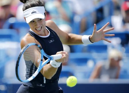 Aug 20, 2017; Mason, OH, USA; Garbine Muguruza returns a shot in the first set of the womens finals match against Simona Halep during the Western & Southern Open at the Lindner Family Tennis Center. Mandatory Credit: Sam Greene/The Cincinnati Enquirer via USA TODAY NETWORK