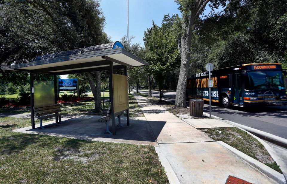 A bus approaches a Regional Transit System stop in Gainesville.