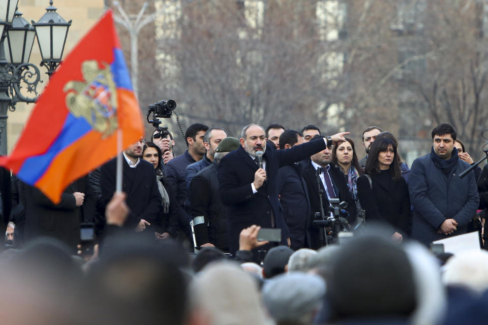 Armenian Prime Minister Nikol Pashinyan gestures speaking to a crowd in the center of Yerevan, Armenia, Thursday, Feb. 25, 2021. Armenia's prime minister has spoken of an attempted military coup after facing the military's General Staff demand to step down. The developments come after months of protests sparked by the nation's defeat in the Nagorno-Karabakh conflict with Azerbaijan. (Hayk Baghdasaryan/PHOTOLURE via AP)