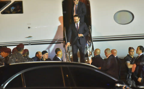 Lebanese Prime Minister Saad Hariri (C) arrives at Beirut International Airport  - Credit: AFP