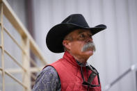 Bill Martin, manager of the Lone Star Stockyards, speaks to The Associated Press about the regional impact of the Smokehouse Creek Fire on local ranchers, Friday, March 1, 2024, in Wildorado, Texas. The wildfire, which started Monday, has left behind a charred landscape of scorched prairie, dead cattle and burned-out homes in the Texas Panhandle. (AP Photo/Julio Cortez)