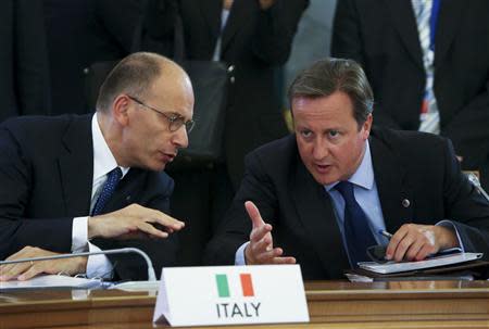 Italian Prime Minister Enrico Letta (L) and Britain's Prime Minister David Cameron attend the first working session of the G20 Summit in Constantine Palace in Strelna near St. Petersburg, September 5, 2013. REUTERS/Sergei Karpukhin
