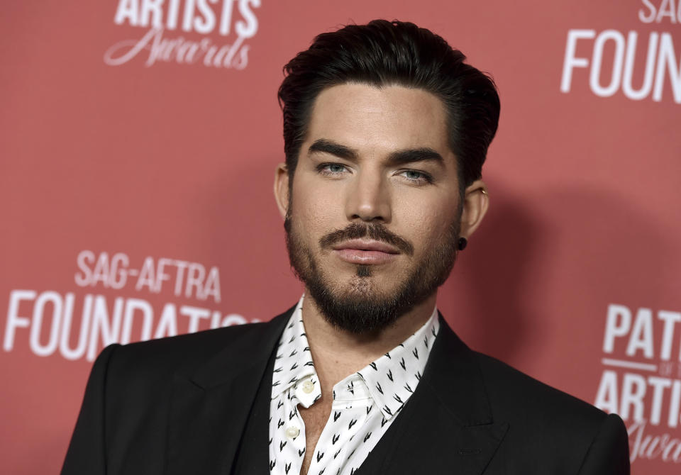 FILE - In this Nov. 8, 2018 file photo, actor Adam Lambert arrives at the Patron of the Artists Awards at the Wallis Annenberg Center for the Performing Arts in Beverly Hills, Calif. Los Angeles police have arrested Benjamin Eitan Ackerman, 32, who they say burglarized the Hollywood Hills homes of celebrities, including Lambert, after casing them while pretending to be a potential buyer or real estate agent during open houses. Detective Jared Timmons said Wednesday, Jan. 2, 2019, that investigators have seized more than 2,000 items worth several million dollars allegedly taken in burglaries in 2017 and 2018. (Photo by Jordan Strauss/Invision/AP, File)