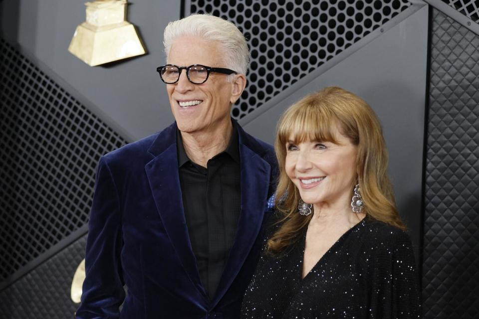 Ted Danson in a velvet blue suit and Mary Steenburgen in a sparkly black dress