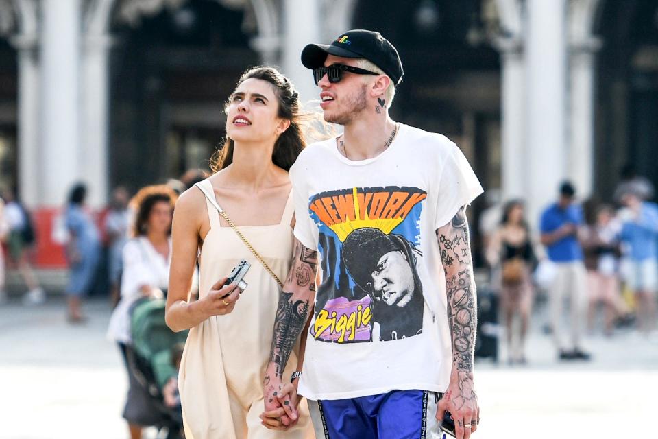 The <a href="https://people.com/movies/pete-davidson-margaret-qualley-date-night-venice-film-festival/" rel="nofollow noopener" target="_blank" data-ylk="slk:rumored couple" class="link ">rumored couple</a> were spotted holding hands in Venice, Italy on Sept. 2, while they were in town for the <a href="https://people.com/movies/venice-film-festival-2019-arrivals-photos/" rel="nofollow noopener" target="_blank" data-ylk="slk:Venice Film Festival" class="link ">Venice Film Festival</a>. During their daytime excursion, the actress, who was there promoting her new film, <em>Seberg</em>, wore a sundress and flats, while Davidson had on a graphic tee and shorts. 