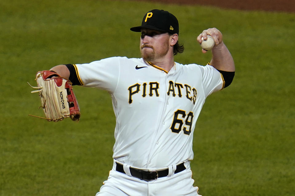 Pittsburgh Pirates first baseman John Nogowski pitches in relief during the ninth inning of the team's baseball game against the Milwaukee Brewers in Pittsburgh, Thursday, July 29, 2021. The Brewers won 12-0. (AP Photo/Gene J. Puskar)