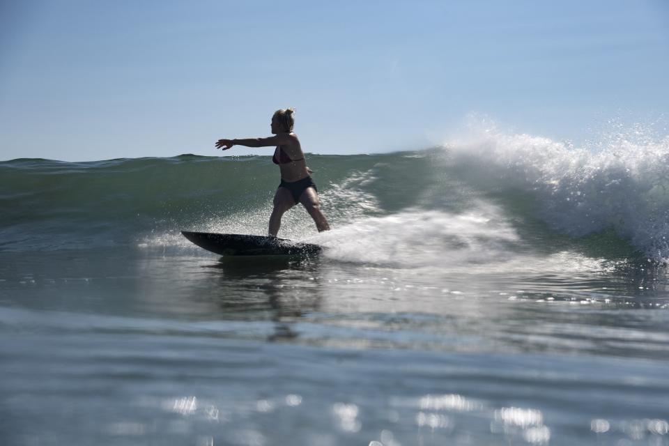 Brazil's Tatiana Weston-Webb rides a wave during a free training session of the Tokyo 2020 Olympic Games at the Tsurigasaki Surfing Beach, in Chiba, on July 24, 2021. (Photo by Olivier MORIN / POOL / AFP) (Photo by OLIVIER MORIN/POOL/AFP via Getty Images)