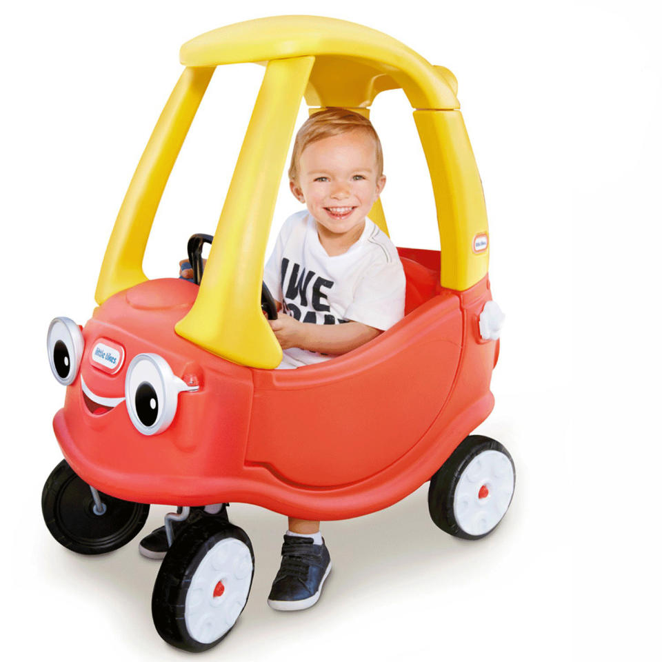 A child inside the toy car