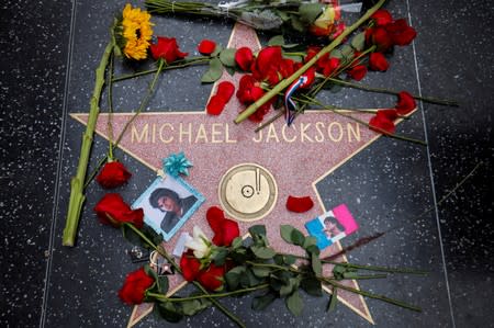 Flowers surround Michael Jackson's star on the Hollywood Walk of Fame ten years after the death of child star turned King of Pop in Los Angeles