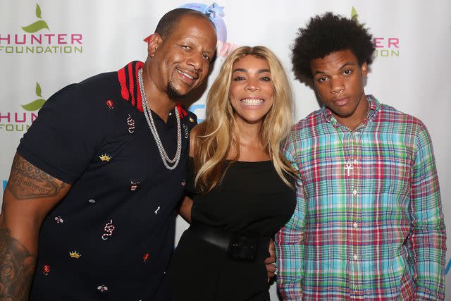 <p>Bruce Glikas/Getty</p> Kevin Hunter, wife Wendy Williams and son Kevin Hunter Jr pose at a celebration for The