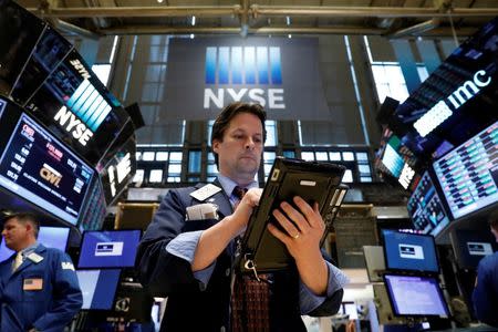 Traders work on the floor of the New York Stock Exchange (NYSE) in New York, U.S., April 24, 2017. REUTERS/Brendan McDermid