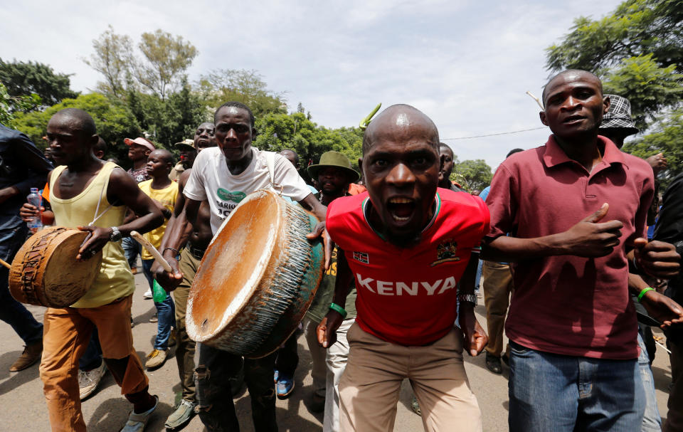 <p>Supporters of Kenyan opposition leader Raila Odinga of the National Super Alliance (NASA) coalition gesture as they walk along a street ahead of his planned swearing-in ceremony as the president of the Peopleís Assembly in Nairobi, Kenya, Jan. 30, 2018. (Photo: Thomas Mukoya/Reuters) </p>