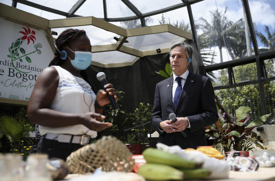 Secretary of State Antony Blinken talks to a local vendor as he visits the Jose Celestino Mutis botanical garden in Bogota, Colombia, Thursday, Oct. 21, 2021. (Luisa Gonzalez/Pool via AP)