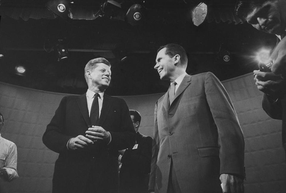 Presidential candidates John F. Kennedy and Richard M. Nixon exchanging smile prior to beginning their 1st TV debate. | Paul Schutzer—The LIFE Picture Collection/Gett