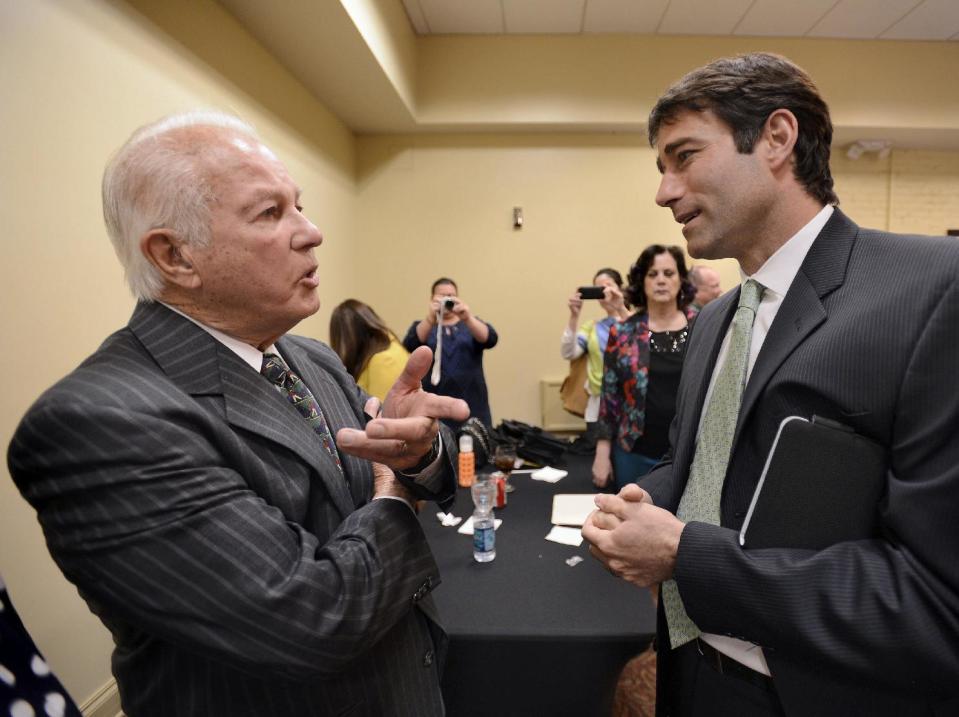 Former Louisiana Gov. Edwin Edwards, left, talks with Garret Graves, right, the former top coastal adviser for Gov. Bobby Jindal, at the Baton Rouge Press Club, Monday, March 17, 2014, in Baton Rouge, La. Edwards announced Monday that he would join the race to represent the state’s Baton Rouge-based 6th District of the U.S. House of Representatives. Graves is also running for that 6th District Congressional office. (AP Photo/Travis Spradling)