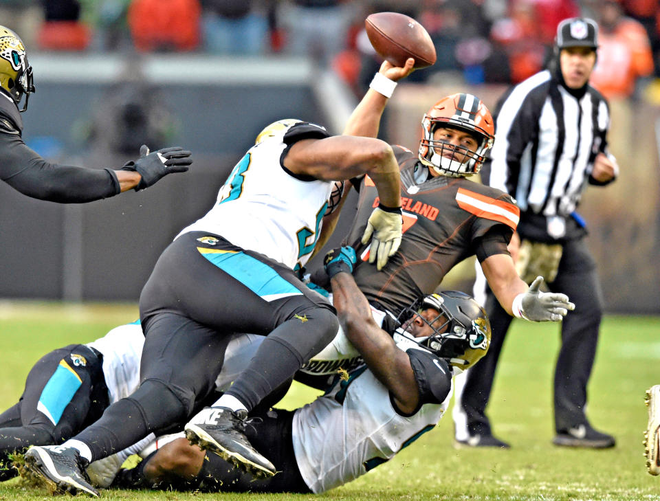 <p>Cleveland Browns quarterback DeShone Kizer (7) is sacked in the second half of an NFL football game against the Jacksonville Jaguars, Sunday, Nov. 19, 2017, in Cleveland. (AP Photo/David Richard) </p>