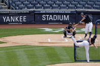 New York Yankees' Aaron Judge, back right, bats against pitcher Jordan Montgomery, foreground, in front of catcher Kyle Higashioka during a baseball workout at Yankee Stadium in New York, Saturday, July 4, 2020. (AP Photo/Adam Hunger)