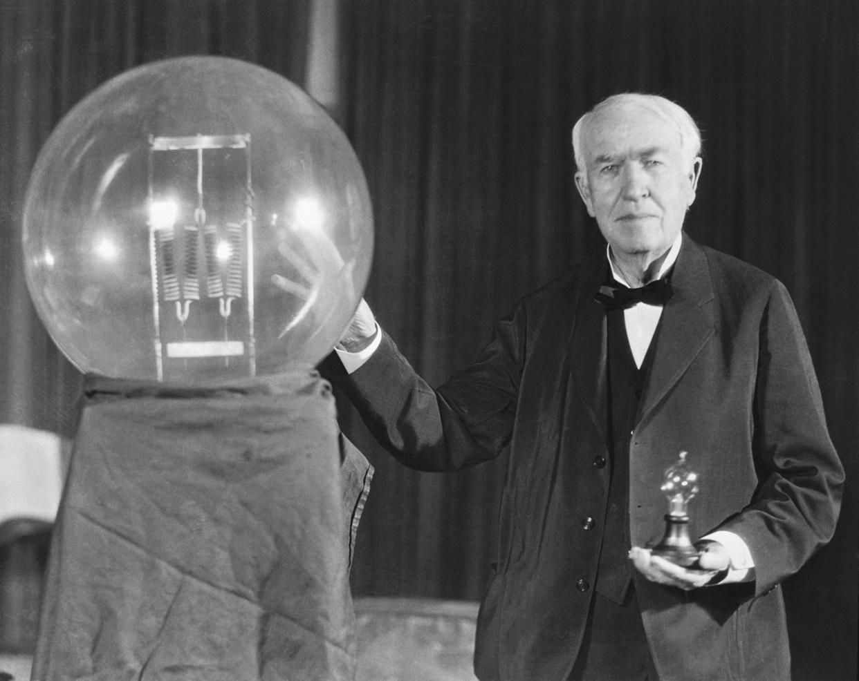 Thomas A. Edison exhibits a replica of his first successful incandescent lamp.