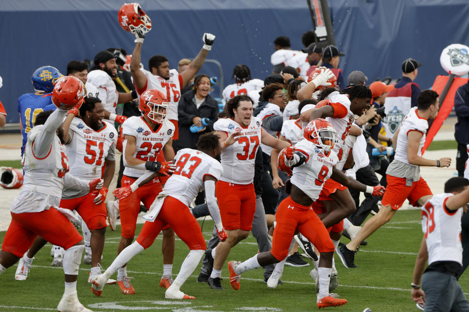 Sam Houston players celebrate as they defeat South Dakota State in the NCAA college FCS Football Championship in Frisco, Texas, Sunday, May 16, 2021. (AP Photo/Michael Ainsworth)