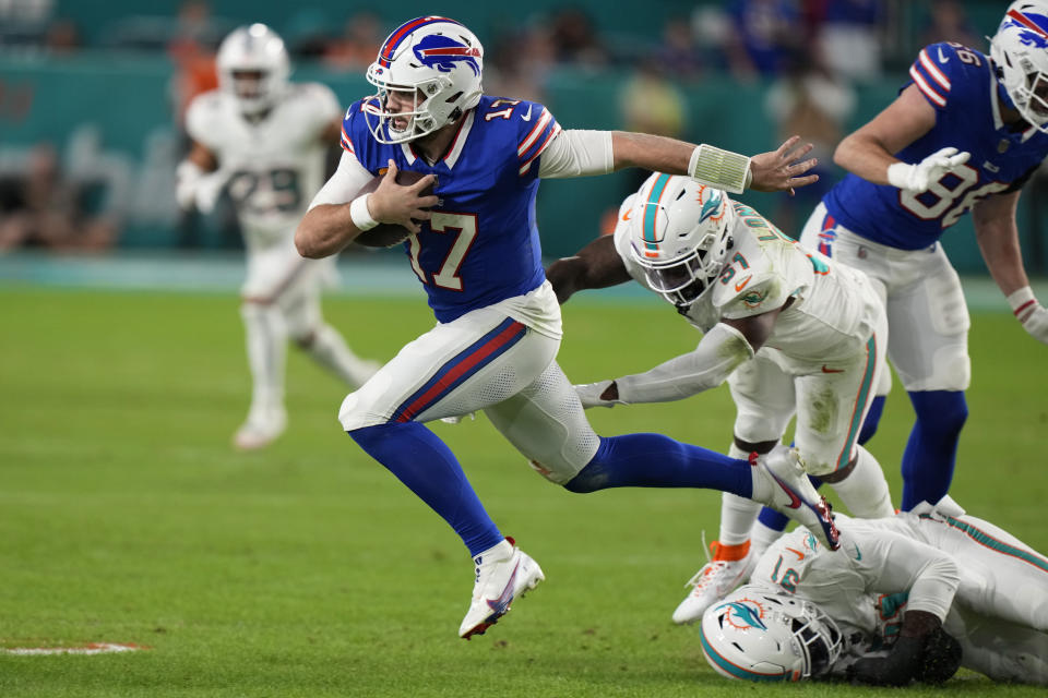 Buffalo Bills quarterback Josh Allen (17) runs the football during the first half of an NFL football game against the Miami Dolphins, Sunday, Jan. 7, 2024, in Miami Gardens, Fla. (AP Photo/Wilfredo Lee)