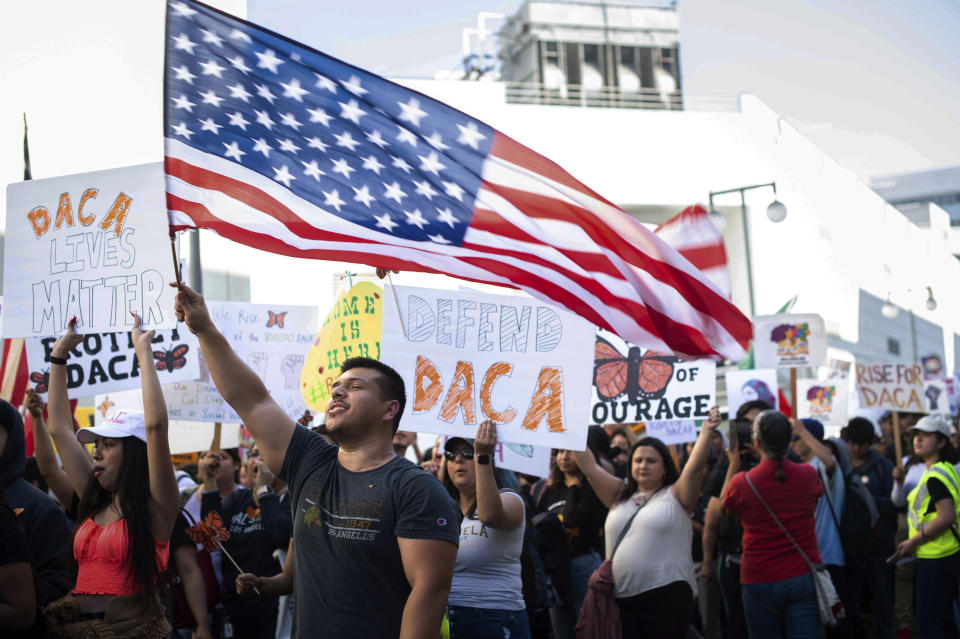 Ernesto Parada, 28, a graduate student at California State University, Northridge, marches Tuesday, Nov. 12, 2019, through downtown Los Angeles to MacArthur Park, to defend the Deferred Action for Childhood Arrivals program while the U.S. Supreme Court considers the fate of the Obama-era immigration program being challenged by the Trump administration. (Sarah Reingewirtz/The Orange County Register/SCNG via AP)