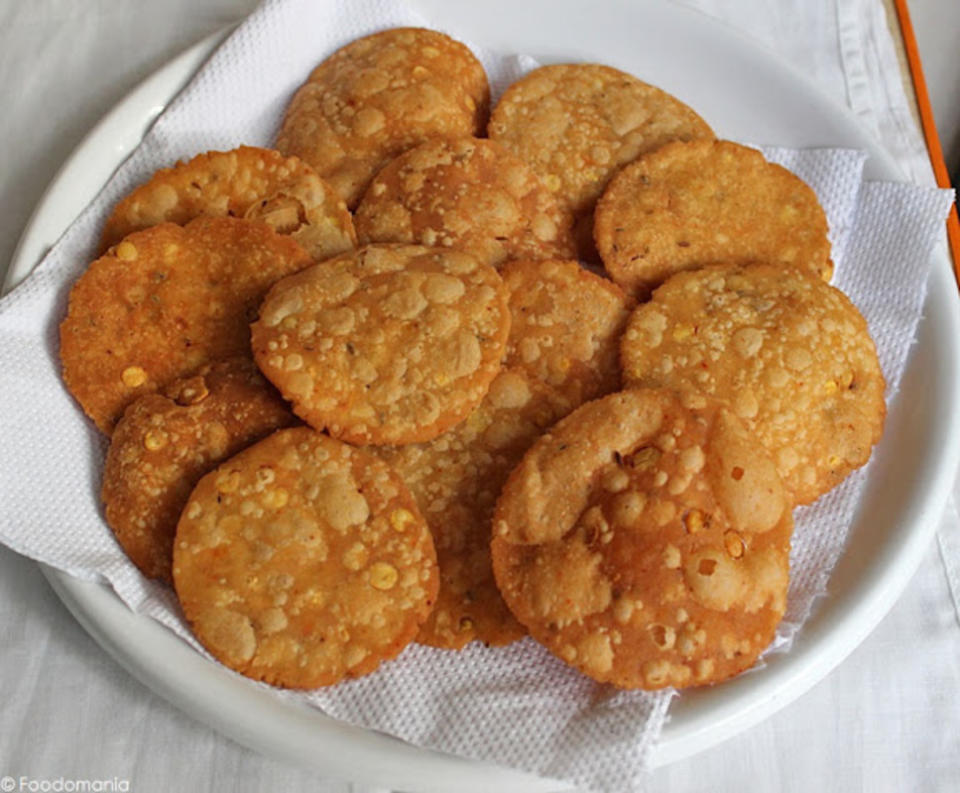 <p>Foodomania</p><p>Getting into some delicious edible gifts, this snack is predominantly made with rice flour, butter and some basic spices commonly used in the South-Indian cuisine, and gets deep-fried. </p><p><strong>Get the recipe: <a href="http://foodomania.com/thattai-recipe/" rel="nofollow noopener" target="_blank" data-ylk="slk:Thattai;elm:context_link;itc:0;sec:content-canvas" class="link ">Thattai</a></strong></p>