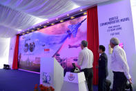 <p>(From left) PM Lee, Chief of Air Force Major-General Mervyn Tan and Defence Minister Ng Eng Hen (right) unveiling the RSAF50 Commemorative Mural. (PHOTO: Mindef) </p>