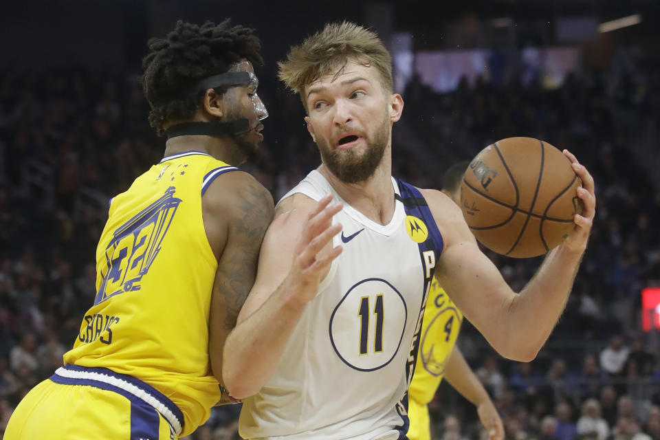 Indiana Pacers forward Domantas Sabonis (11) is defended by Golden State Warriors forward Marquese Chriss during the first half of an NBA basketball game in San Francisco, Friday, Jan. 24, 2020. (AP Photo/Jeff Chiu)