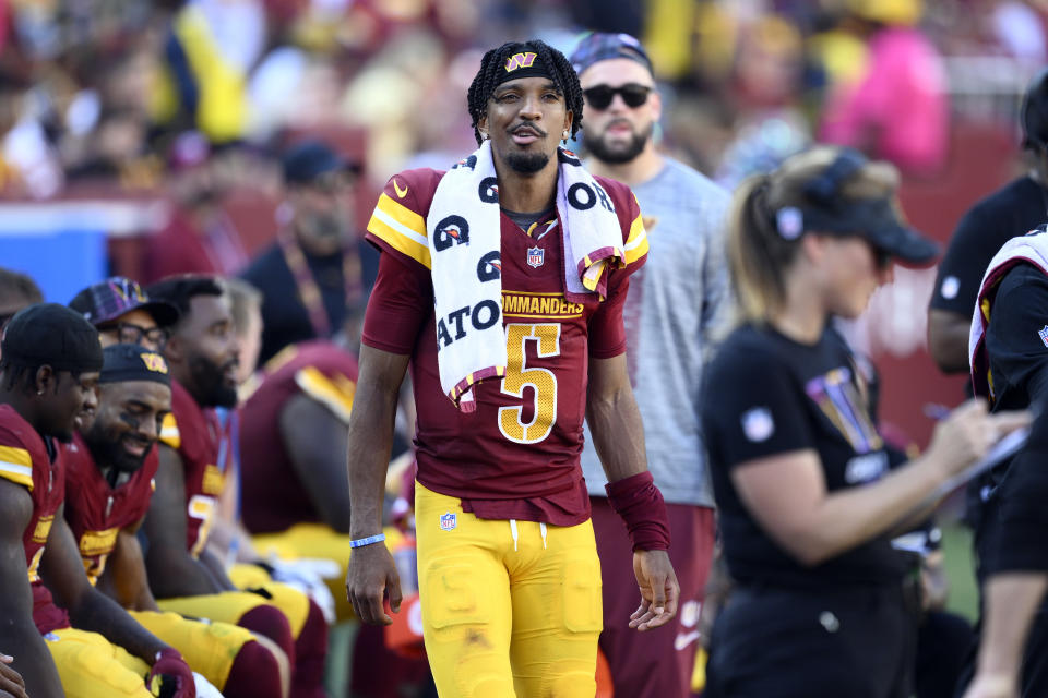 Washington Commanders quarterback Jayden Daniels (5) watches from the sidelines in the fourth quarter against the Cleveland Browns of an NFL football game in Landover, Md., Sunday, Oct. 6, 2024. (AP Photo/Nick Wass)