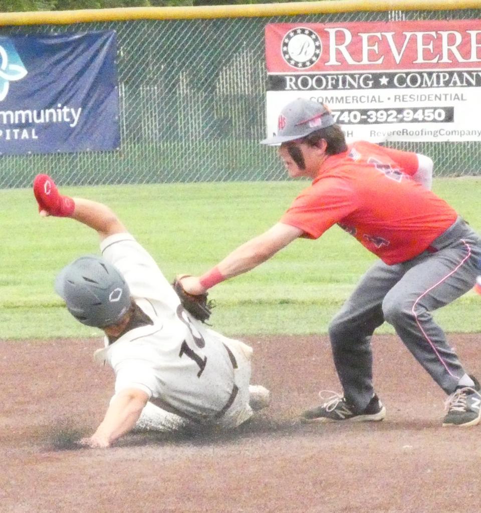 Johnstown junior second baseman Chase Boroff tags out Buckeye Valley's Tanner Domyanick after taking a throw from senior catch Gavin Warden during a Division II district final on Saturday, May 28, 2022 at Mount Vernon Nazarene. The Johnnies fell 5-4 in 10 innings to Barons.
