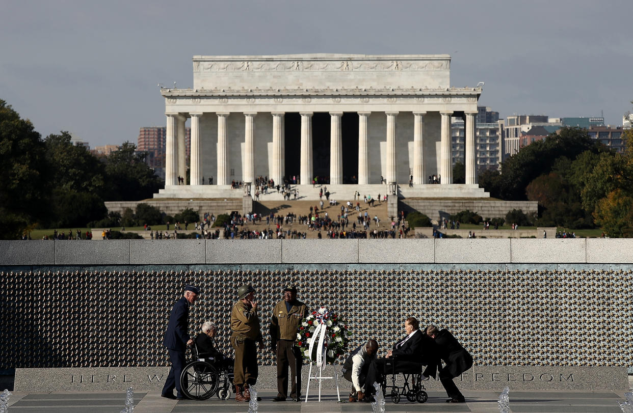 Image: Former Senator Bob Dole, a veteran, participates in a wreath laying ceremony at a Veterans Day event at the World War Two Memorial in Washington on Nov. 11, 2016. (Win McNamee / Getty Images file)