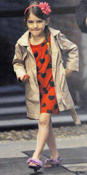 Trench coat? Check. Purple child-sized heels? Check. Adorable hair accessory? Check. Old school gangster-inspired swagger? Double check! (NYC, March 2011)