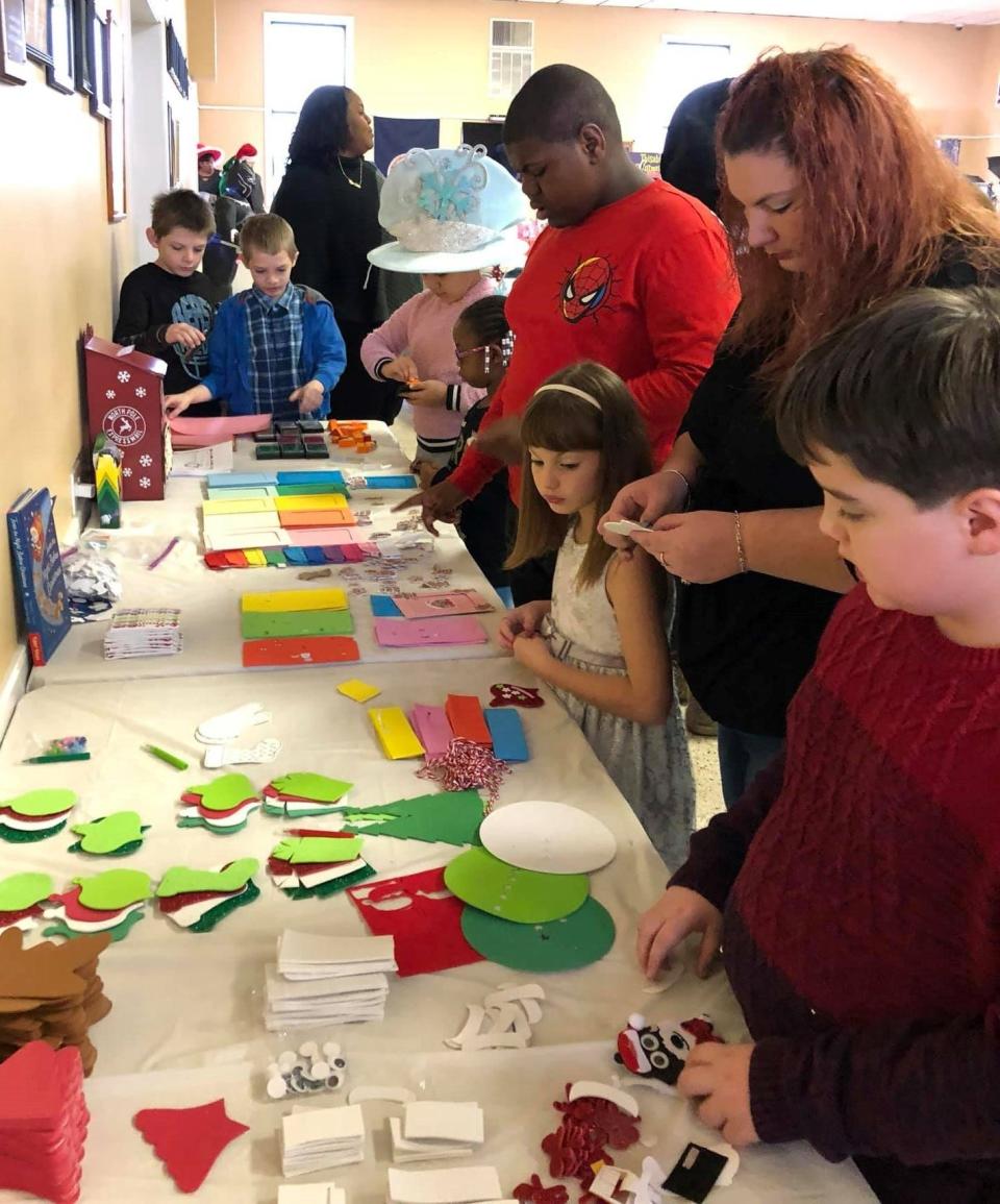 At a Christmas program hosted by Thisability nonprofit organization, children with special needs and their families make crafts at VFW Post 637 in Hopewell in November 2019.